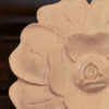 California wood rosettes are carved with flower motif